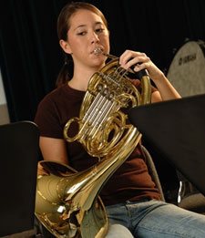 a girl playing an instrument
